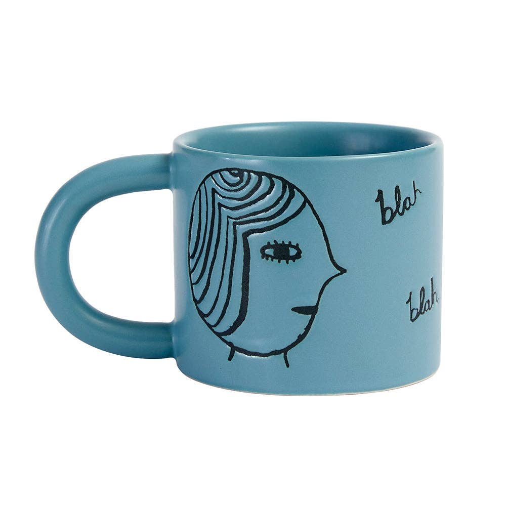 Tasse mit Gesichtern in Türkis